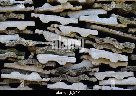 Background texture of old gray concrete fence with square pattern and concrete plates Stock Photo