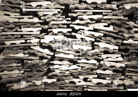 Background texture of old gray concrete fence with square pattern and concrete plates Stock Photo