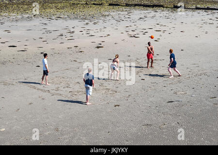 Five people playing volley ball on Douglas beach, Isle of Man Stock Photo