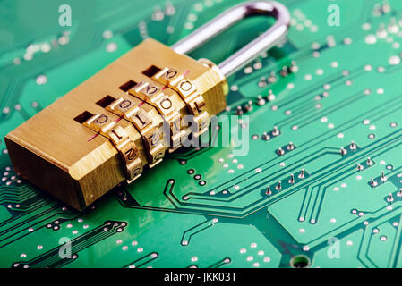 Lock on the background of the computer motherboard, the concept of cyber security Stock Photo