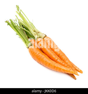 Heap of fresh carrots with stems isolated on white background Stock Photo