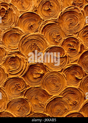 circular shell spiral background pattern texture on the earthen wall surface, detail backdrop design closeup abstract Stock Photo