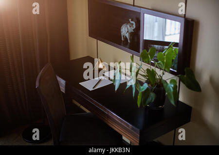 office stuff with notepad, laptop and mouse notepad top view shot. Stock Photo