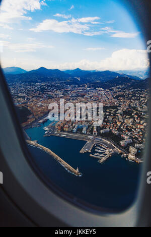 NICE, FRANCE - August 16th, 2016: Aerial view of the city of Nice, France and surrounding coastline while landing at Nice Airport on a serene summer a Stock Photo