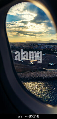 NICE, FRANCE - August 16th, 2016: Aerial view of the Nice, Airport and surrounding coastline while landing Stock Photo