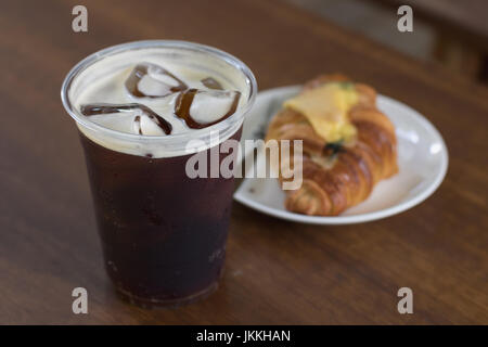 Sparkling Nitro Cold Brew Coffee on table outdoor cafe ready to drink Stock Photo
