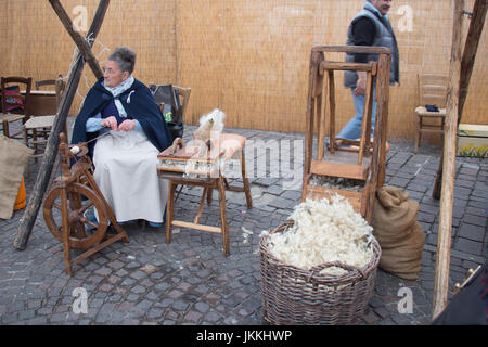Italy, Bologna - November 20 2016: knitter women on their work on market on November 20 2016 in Bologna, Emilia Romagna , Italy. Stock Photo
