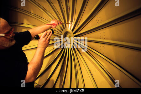 Skilled aerospace workers build a commercial Boeing 737 aircraft. Stock Photo