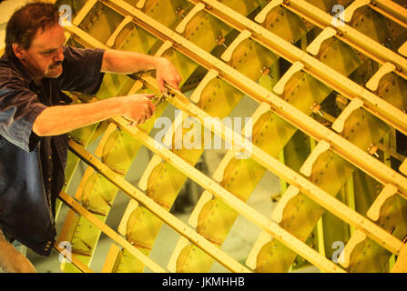 Skilled aerospace workers build a commercial Boeing 737 aircraft. Stock Photo