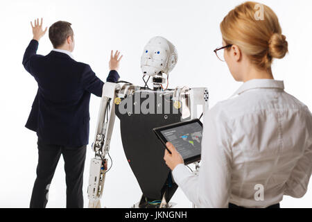 Two excited colleagues running an experiment Stock Photo