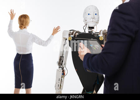 Talented bright man controlling the experiment Stock Photo