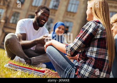 Easy going sweet people engaged in fruitful discussion Stock Photo