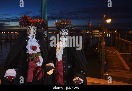male and female Baute Mask wearers in the Carnival of Venice, Italy Stock Photo