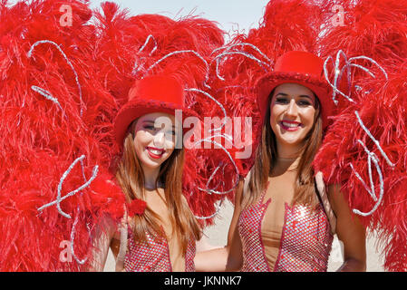 Blackpool, UK. 23rd July, 2017. Blackpool's First international carnival: Todays first international carnival takes place in the seaside town under glorious summer sunshine on the Promanade between Central and South piers. Show girsl in feathers.Credit: Kev Walsh/Alamy live news Stock Photo