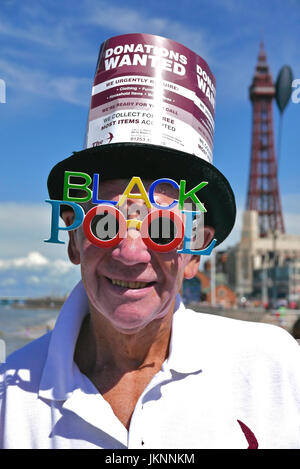 Blackpool, UK. 23rd July, 2017. Blackpool's First international carnival: Todays first international carnival takes place in the seaside town under glorious summer sunshine on the Promanade between Central and South piers. Charity worker in Blackpool sunglasses. Kev Walsh Alamy live news Stock Photo