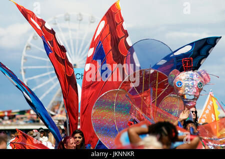 Blackpool, UK. 23rd July, 2017. Blackpool's First international carnival: Todays first international carnival takes place in the seaside town under glorious summer sunshine on the Promenade between Central and South piers. The parade made its way passed the Big Wheel on Central pier. Kev Walsh/Alamy life news Credit: kevin walsh/Alamy Live News Stock Photo