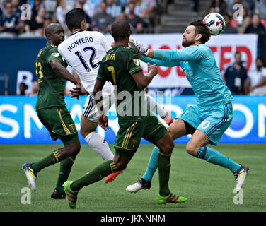 Vancouver, Canada. 23rd July, 2017. Jake Gleeson (1st R), goalie of Portland Timbers, saves as Fredy Montero (2nd L) of Vancouver Whitecaps attacks during the 2017 Major League Soccer (MLS) match between Portland Timbers and Vancouver Whitecaps at BC Place Stadium in Vancouver, Canada, on July 23, 2017. Portland Timbers won 2-1. Credit: Andrew Soong/Xinhua/Alamy Live News Stock Photo