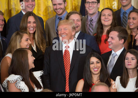 Washington DC, USA. 24th July, 2017. United States President Donald J. Trump poses for photographs with an outgoing group of interns at The White House in Washington, DC, July 24, 2017. Credit: Chris Kleponis/CNP /MediaPunch Credit: MediaPunch Inc/Alamy Live News Stock Photo