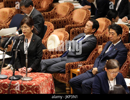 Tokyo, Japan. 24th July, 2017. Japanese Defense Minister Tomomi Inada (L) answers a question to an opposition lawmaker at the Lower House's budget committee session at the national Diet in Tokyo on Monday, July 24, 2017, while Prime Minister Shinzo Abe (R) looks on. Abe said he was not asked by his friend Kotaro Kake for help in opening a new university department in Imabari. Credit: Yoshio Tsunoda/AFLO/Alamy Live News Stock Photo