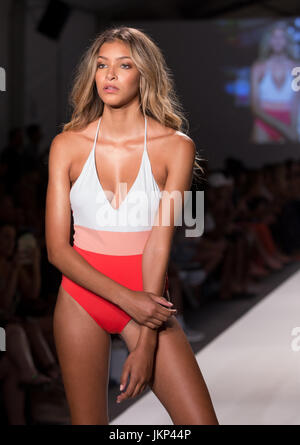 MIAMI BEACH, FL - JULY 23: A model walks the runway during the SWIMMIAMI Tavik 2018 fashion show at Show Tent in Miami Beach. July 23, 2017. Credit Aaron Gilbert/MediaPunch Stock Photo