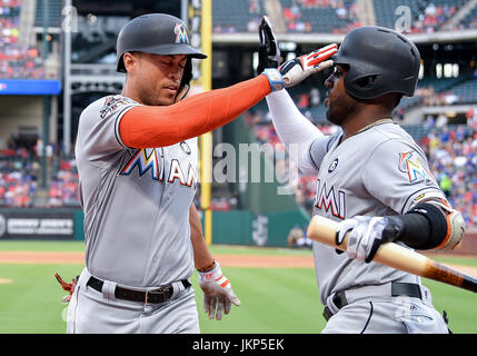 Arlington, Texas, USA. July 24th, 2017:.Miami Marlins right fielder Giancarlo Stanton (27) celebrates with Miami Marlins left fielder Marcell Ozuna (13) after hitting for a home run during a game between the Miami Marlins and the Texas Rangers at Globe Life Park in Arlington, Texas.Manny Flores/CSM Credit: Cal Sport Media/Alamy Live News Stock Photo