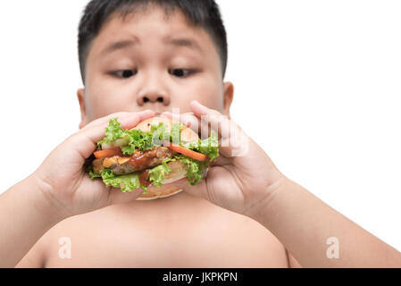 pork hamburger on obese fat boy hand background isolated on white, unhealthy food, junk food or fast food Stock Photo