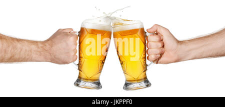 hands with beer mugs making toast Stock Photo