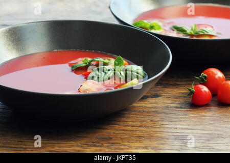 Homemade Gazpacho tomato soup in brown bowl. Healthy eating concept Stock Photo