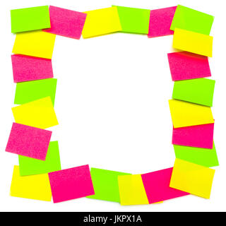 Colorful reminders: frame from paper stickers (green, yellow, pink) isolated on white background. Stock Photo