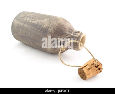 The lying ceramic vessel in the form of bottle with stopper. It is isolated on a white background. Stock Photo