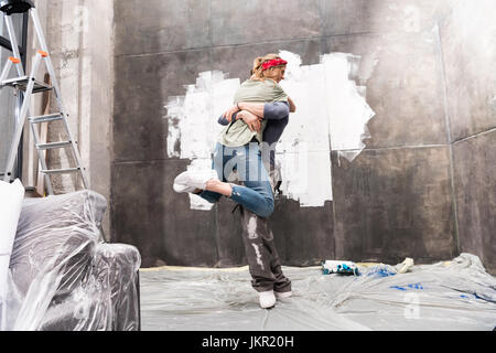 young happy couple having fun, renovation home concept Stock Photo