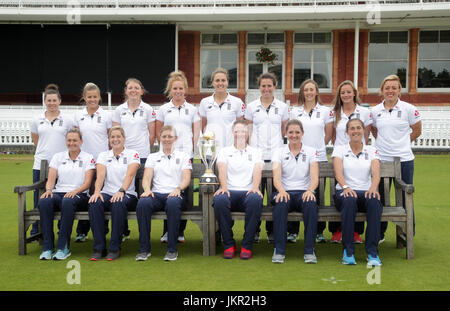 The England women cricket team pose with the World Cup trophy during a media call at Lord's, London. Stock Photo