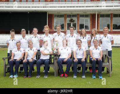 The England women cricket team pose with the World Cup trophy during a media call at Lord's, London. Stock Photo