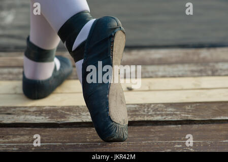 Blue ballet shoes with white socks in ballerina. Stock Photo