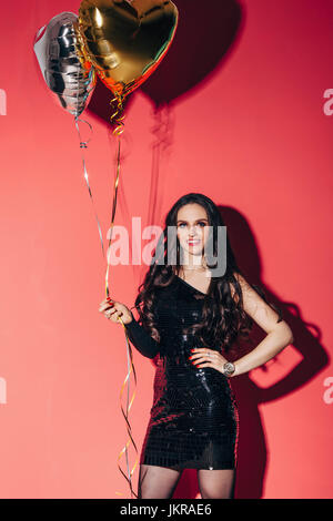 Red balloon on silver string Stock Photo - Alamy