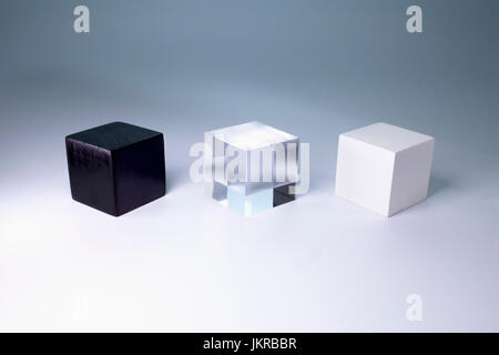 Various block shapes arranged side by side on gray background Stock Photo