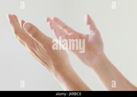 Cropped image of man gesturing hands against white background Stock Photo