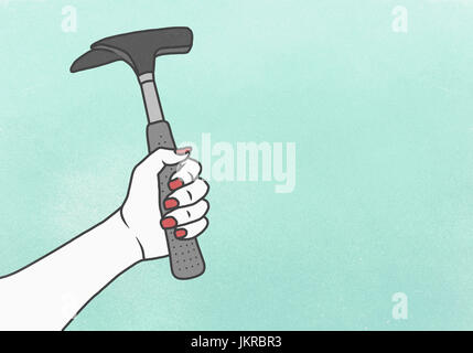 Cropped image of woman holding hammer against blue background Stock Photo