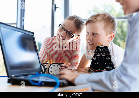 Lovely children checking out new software Stock Photo
