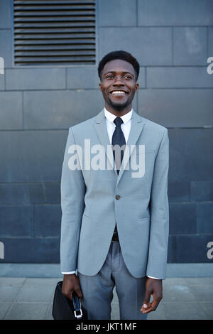 Happy young businessman in suit and tie Stock Photo