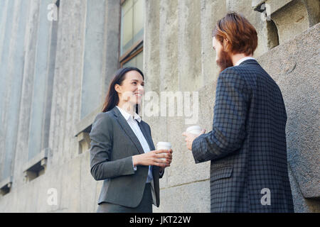 Two young entrepreneurs talking about joint venture Stock Photo
