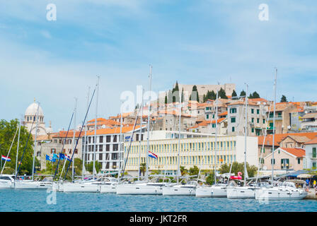 Sailing boats, Riva, with St Michaels fortress on top of the hill, above the old town, Sibenik, Dalmatia, Croatia