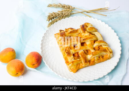 Sweet fruit pie slice with apricot on a plate Stock Photo