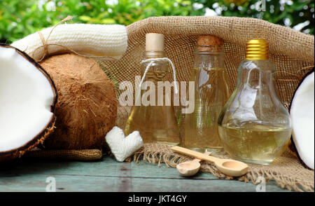 Nature cosmetic products, coconut oil from copra in glass jar, essential oil for skin care, rich vitamin, organic cosmetic also massage oil at spa Stock Photo