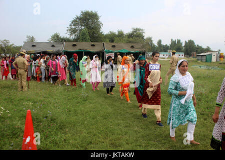 Anantnag, India. 24th July, 2017. Kashmiri girls participate to qualify the test during a police recruitment rally on July 24, 2017 in Anantnag, India. A recruitment drive by the police in Kashmir evoked an overwhelming response, with nearly 3,000 young men and women turning up for it. The candidates, who have qualified the physical test, will have to appear in the written test for final selection for which the dates will be issued separately. Credit: Muneeb Ul Islam/Pacific Press/Alamy Live News Stock Photo