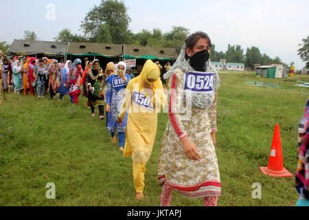 Anantnag, India. 24th July, 2017. Kashmiri girls participate to qualify the test during a police recruitment rally on July 24, 2017 in Anantnag, India. A recruitment drive by the police in Kashmir evoked an overwhelming response, with nearly 3,000 young men and women turning up for it. The candidates, who have qualified the physical test, will have to appear in the written test for final selection for which the dates will be issued separately. Credit: Muneeb Ul Islam/Pacific Press/Alamy Live News Stock Photo