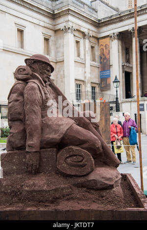 A sculpture of a World War One soldier made out of Flanders Fields mud, in Trafalgar Square, London. PRESS ASSOCIATION Photo. Picture date: Monday July 24th, 2017. The sculpture has been commissioned by Visit Flanders to commemorate the 100th anniversary of the start of the Battle of Passchendaele, which began on July 31st 1917. Photo credit should read: Matt Crossick/PA Wire. Stock Photo