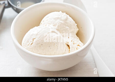 Vanilla ice cream scoops in white bowl Stock Photo