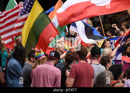 Pride in London, 2017.  Flag bearers march with world flags during the parade. Stock Photo
