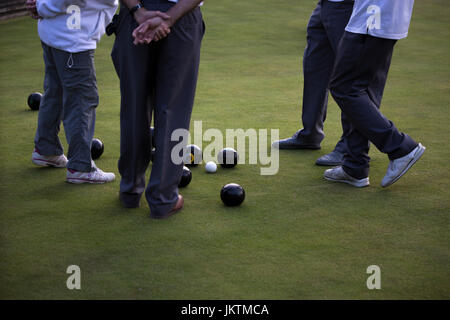 Lawn bowls players scoring. Stock Photo